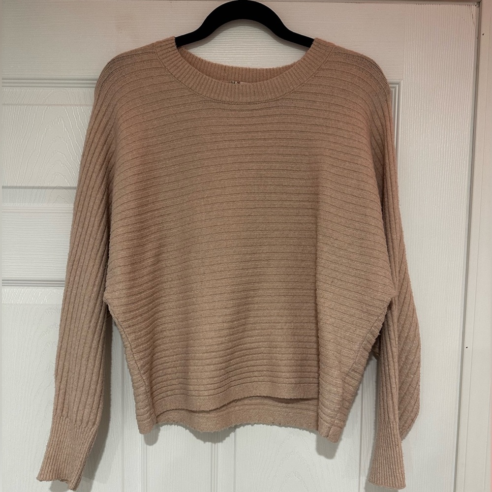 a pink sweater